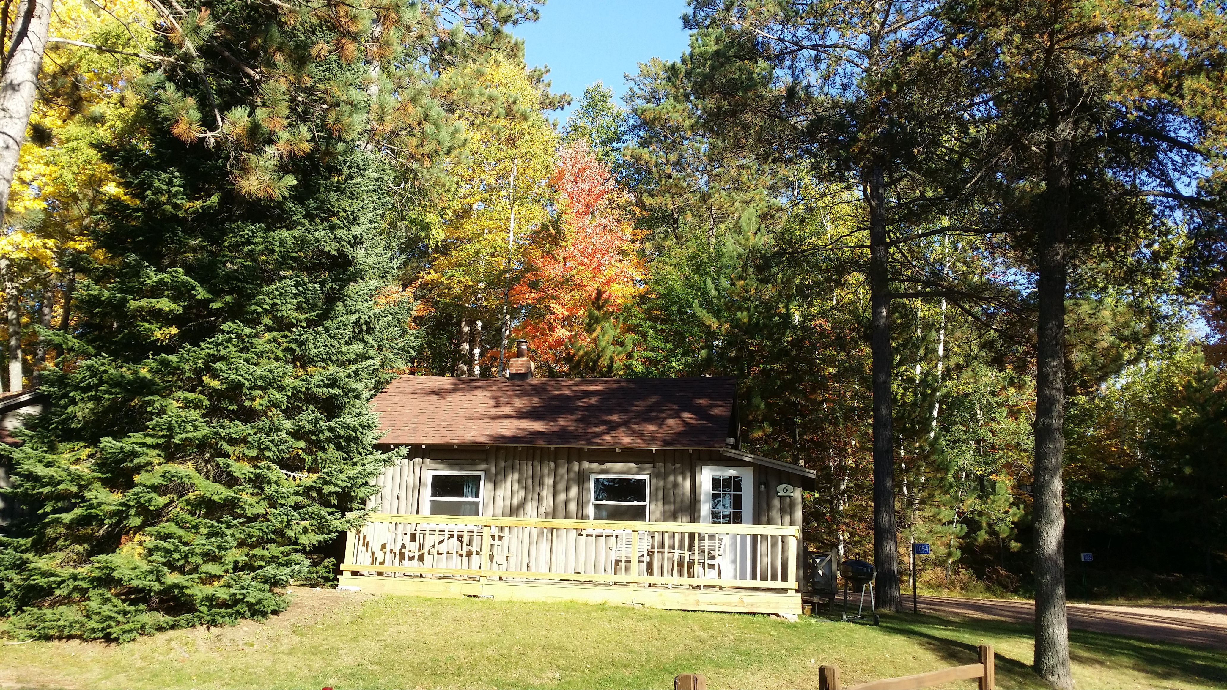 Warm and welcoming with fall colors and that big porch! 